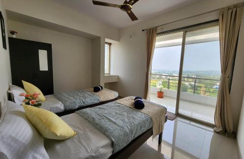 Nashik Apartment | Trinity Stays Nashik - Mountain view Entire Apartment close to Sula