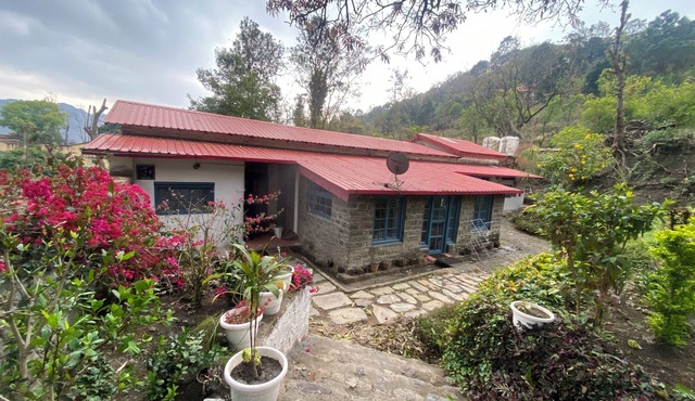 A heritage British bungalow beautifully restored as a homestay near Nainital.