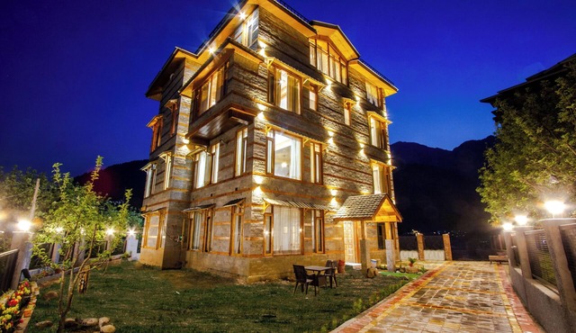 Bedroom in a stone and wood chalet admist apple garden