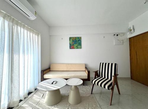 Boutique 1BHK Pool Retreat with Modern Amenities and Private Balcony