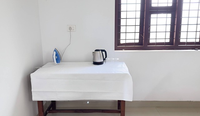 Charming 1-bedroom house in Koyilandy with WiFi access