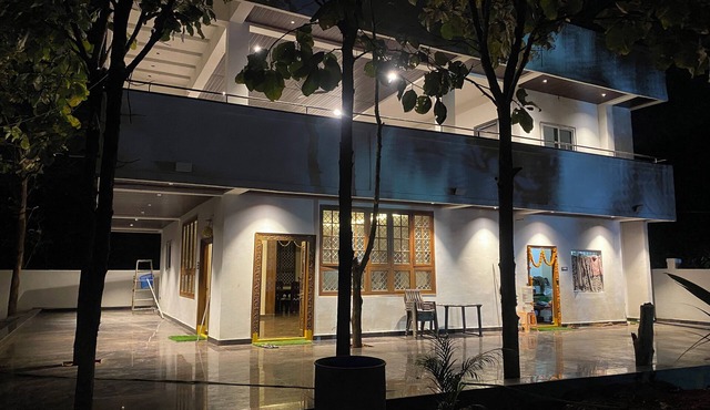 Charming 3-bedroom farmhouse in delightful Hyderabad with AC, Wi-Fi and pool.