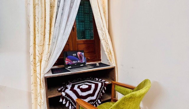 Cozy 1-bedroom, 1-bathroom homestay with all amenities & walkway for relaxation.