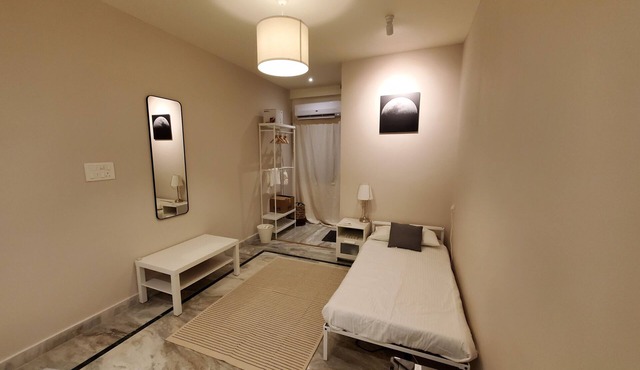 Cozy 1-bedroom apartment in charming Manikonda with AC, WiFi, water heater.