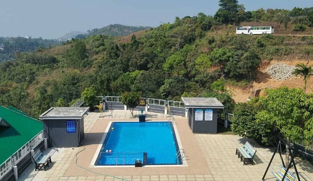 Escape To Serenity, Vagamon's Hidden Gem: Luxurious Poolside Haven.