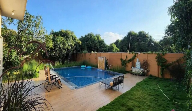 Farm with modern 3 BHK pool villa providing green retreat for urban dwellers.