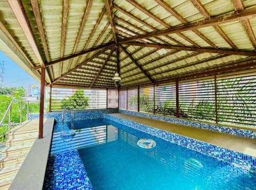Lagoon Luxe 4BHK Luxury Terrace Pool Villa with Private Theatre & Pool Table by Spacez