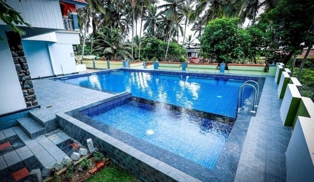 Ocean Queen Palace Poovar – Deluxe Double Room with Balcony & Stunning Sea View