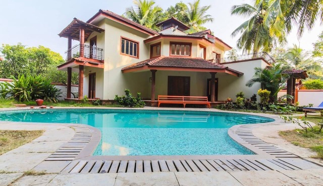 Outdoor Pool with Classic Bedroom in Goa