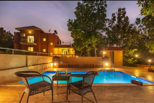 SaffronStays Ekaant- 3BR pet-friendly pool villa with lawn, games & river walk in gated community near Mumbai
