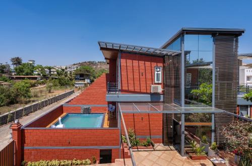 SaffronStays Hobbes - 3BR private pool villa with lawn, family lounge, BBQ nights & deck sit-outs, ideal for celebrations