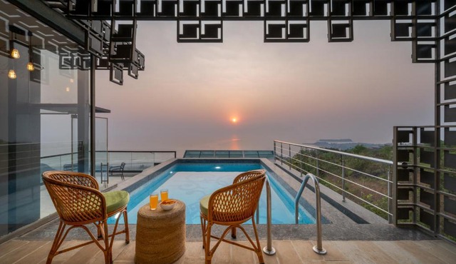 SaffronStays Nautica - 5BR hilltop villa with rooftop pool, sea views & modern interiors surrounded by greenery