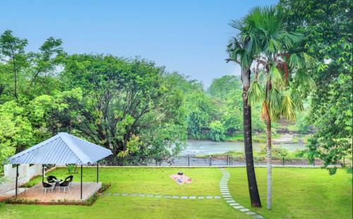 SaffronStays Nilaya by the River - 3BR riverside villa with private pool, bonfire, BBQ & river views
