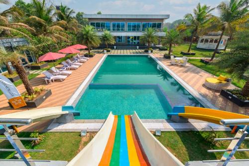 SaffronStays Palm Paradise - twin 3BR villas with pool, slides, mango plantations & outdoor games near Mumbai