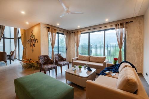 SaffronStays Pebble House - 3BR riverside villa with glass walls, terraces & Nun River views, Dehradun