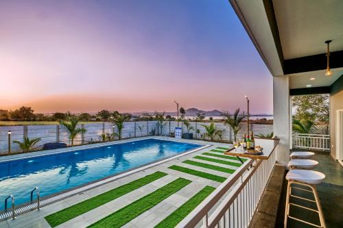 SaffronStays Six Oaks - 4BR Lakeside Villa with Pool, Games Room & Backwater Views