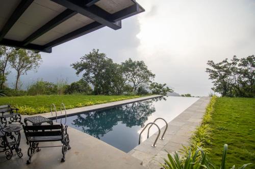 SaffronStays Solasta - 2BR luxury villa with black marble infinity pool, lotus pond & dam views in Mulshi