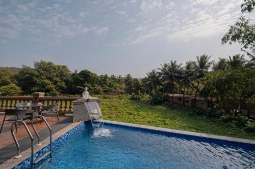 SaffronStays Tudor San Ann - 5BR Candolim villa with infinity pool, lift & sunrise-view rooms near beach