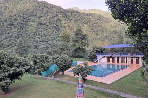 Shri Bhagrith Resort pool and restaurant