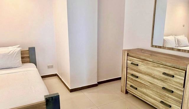 Spacious 3-bedroom apartment in vibrant Dar es Salaam with WiFi AC Swimming pool in Dar es Salaam