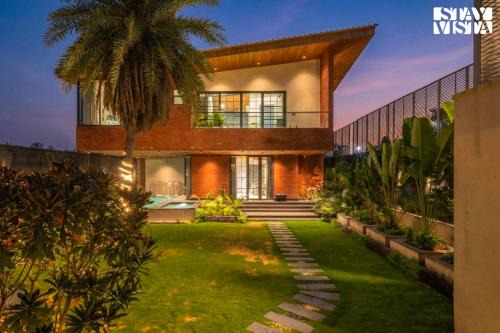 StayVista at Palm Tree Breeze with Pool, Bonfire