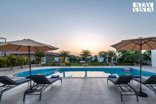 StayVista at The Grand Ten with lawn and pool