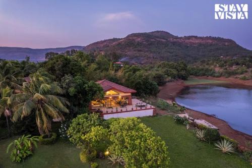 StayVista at Three Shores with Lake View & Alfresco Dining