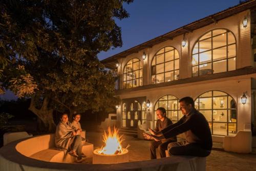 StayVista's Casa Blanca - Modern elegance with a pool, spacious lawn & diverse activities