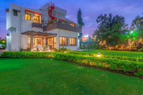 StayVista's Fairfield Villa - A green lawn and charming orchard await your retreat