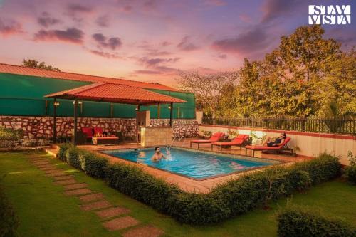 StayVista's Rustique Radiance - Hillside Retreat with Outdoor Pool & South Indian Architecture