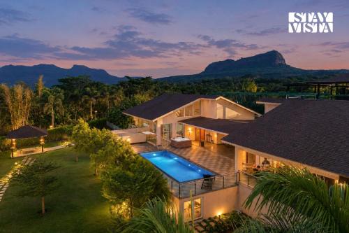StayVista's The Tavern At Canary Farms - Mountain-View Luxury Mansion with Infinity Pool & Games Zone
