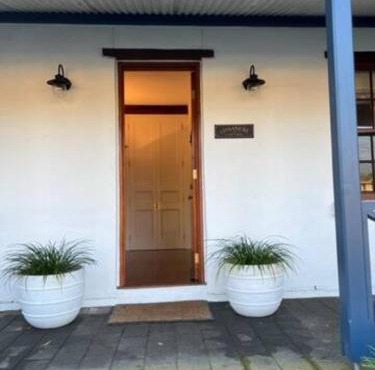 Two roomed private suite in front of cottage in Grange