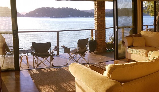 Waterfront with private jetty and sunset views. Boat access only. Pet friendly.