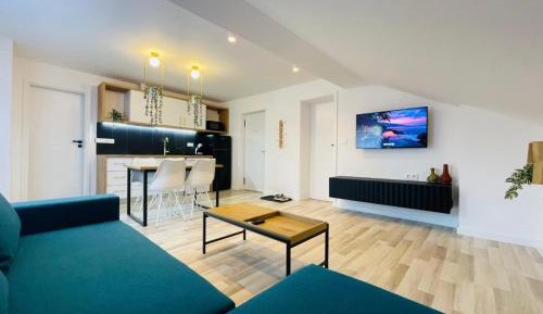 One-Bedroom Apartment with Balcony and City View